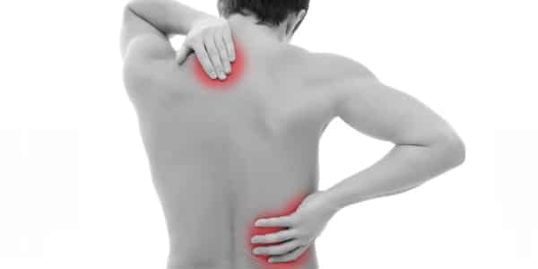 picture of person touching there back where they are having back pain